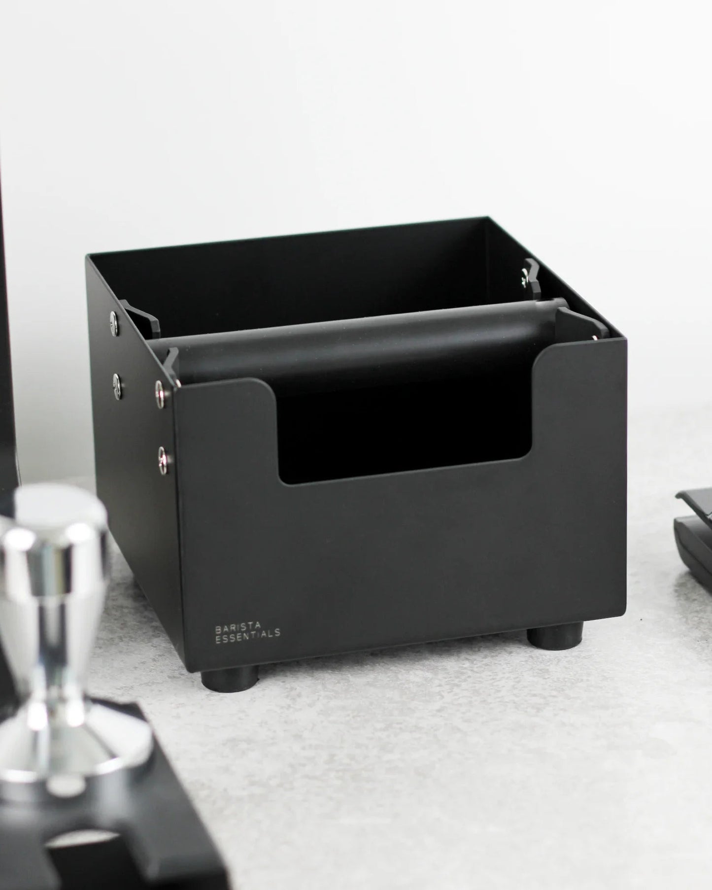 Square coffee knock box in a home barista coffee corner